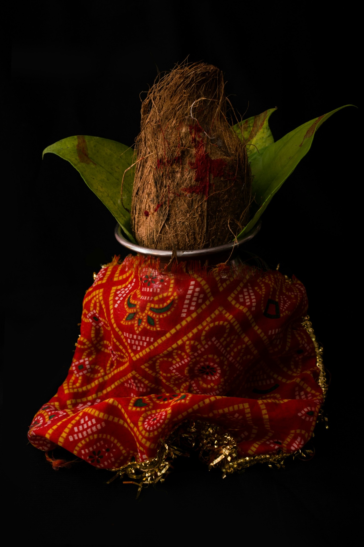 Kalash with coconut and mango leaves