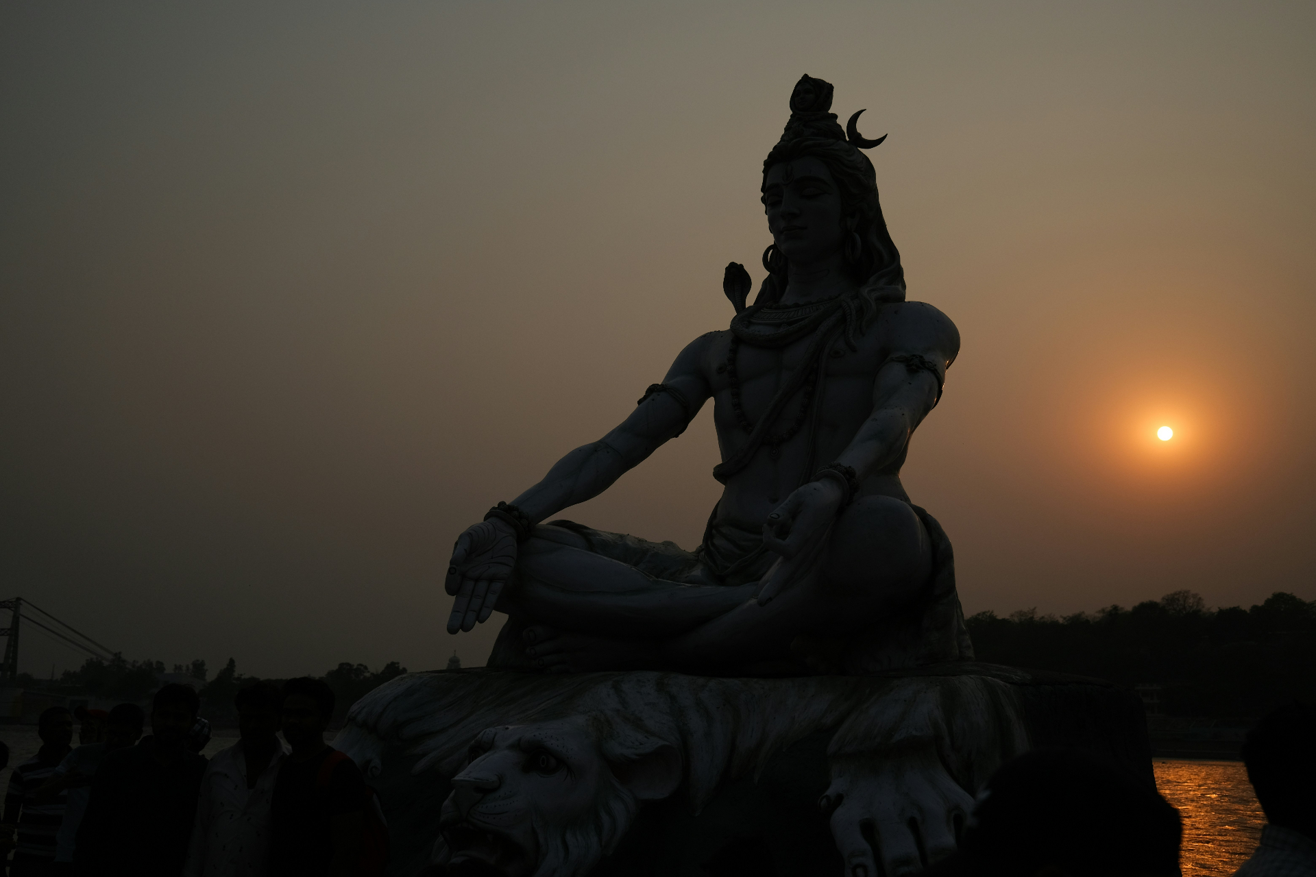 Lord Shiva statue at sunset on the Ganga